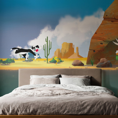 Fototapet Looney Tunes 206 cu Bugs Bunny, Sylvester și Tweety într-un dormitor modern, pe un perete cu peisaj de deșert animat.