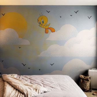 Fototapet Looney Tunes 218 cu Tweety zburând pe cer printre nori și soare, într-un dormitor modern de copii cu pat și accesorii.