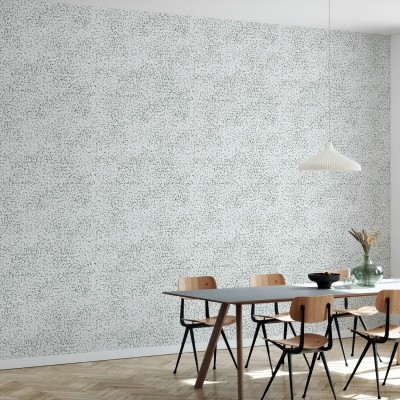 Tapet cu model subtil de puncte verzi pe fond alb, în amenajarea unui living modern
