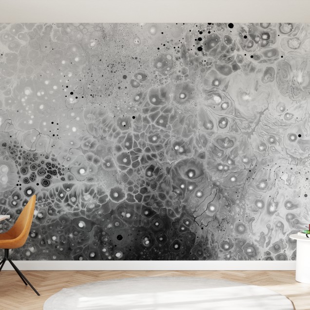 Tapet modern abstract cu model sferic în tonuri de gri și alb, aplicat pe un perete în dormitor.