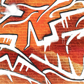 Fototapet cu graffiti portocaliu pe zid de cărămidă