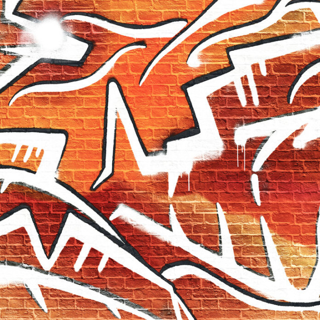 Fototapet cu graffiti portocaliu pe zid de cărămidă