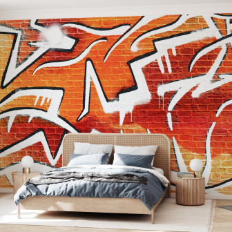 Fototapet cu graffiti portocaliu pe zid de cărămidă