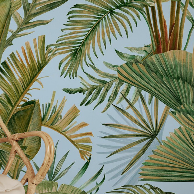 Fototapet cu design tropical - frunze verzi pe fundal albastru