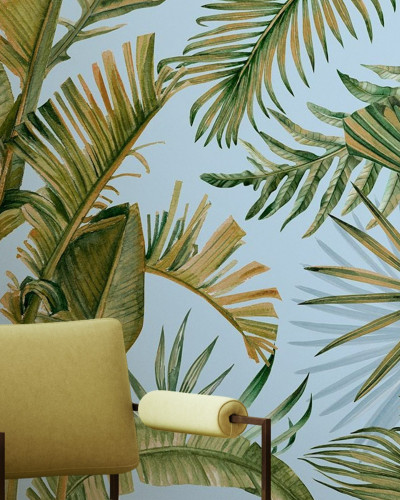 Fototapet cu design tropical - frunze verzi pe fundal albastru