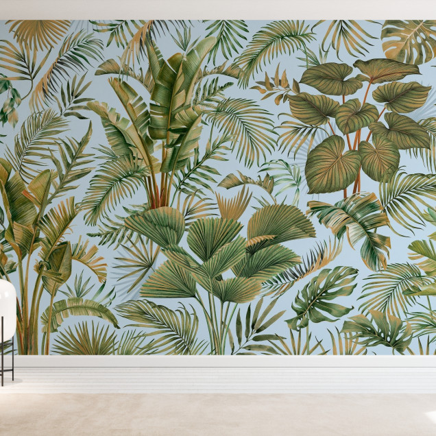 Fototapet cu design tropical - frunze verzi pe fundal albastru