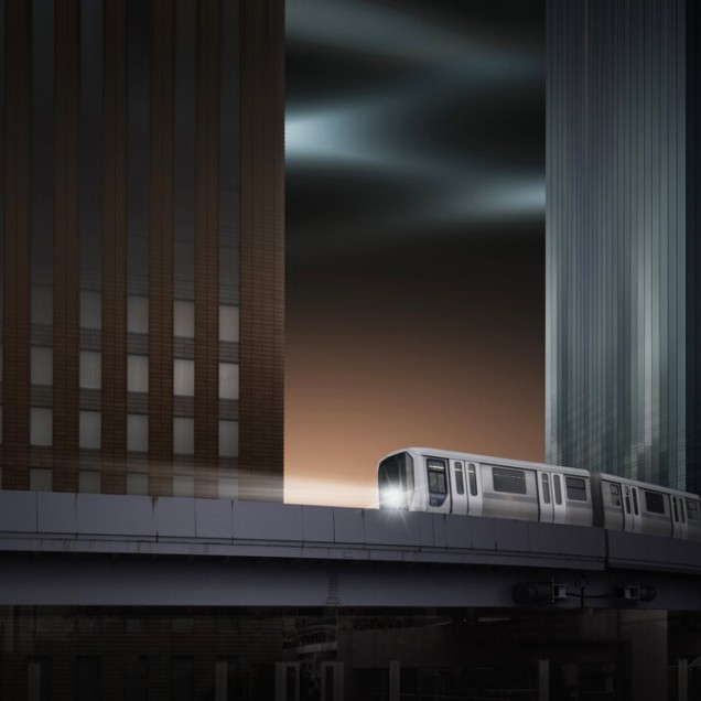 Fototapet cu un tren care merge printr-o cladire inalta.