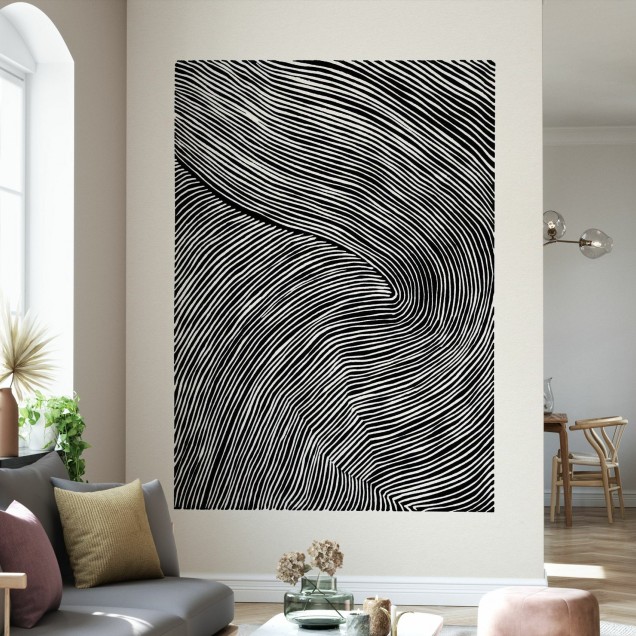 Tapet modern cu dungi Stripes Linocut, Black III, în nuanțe de negru și alb, pe un perete în living.