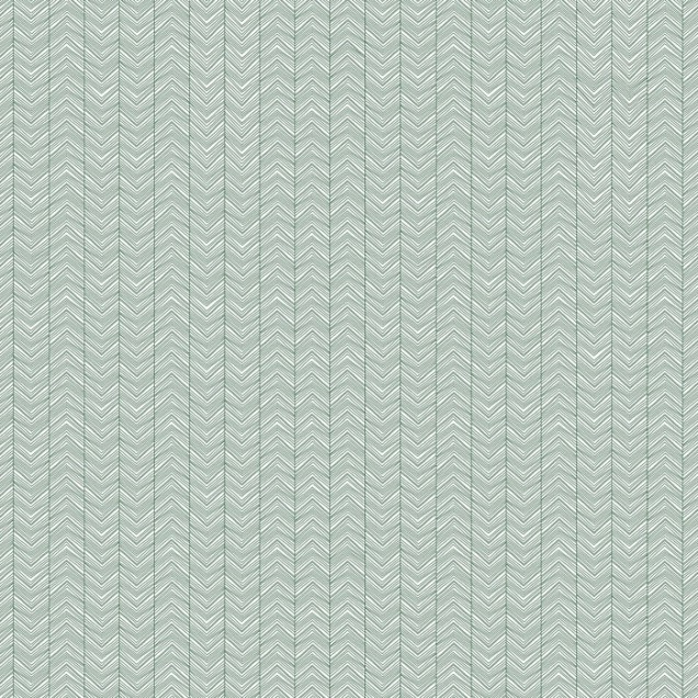 Tapet Herringbone Green în living, cu canapea gri și scaun din răchită.