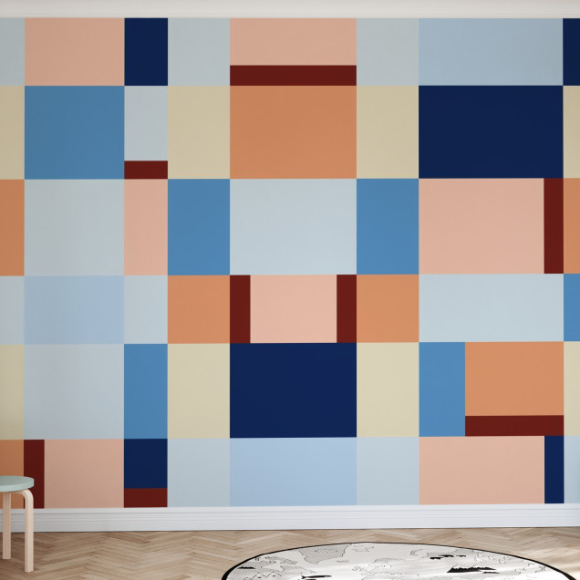 Fototapet cu design geometric în nuanțe de albastru și piersică în camera unui copil.