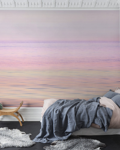 Fototapet cu imagine a unui apus de soare pe mare, cu culori pastelate.