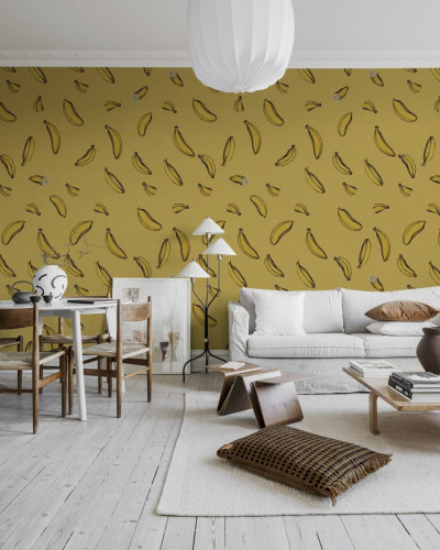 Un perete cu wallpaper cu banane galbene