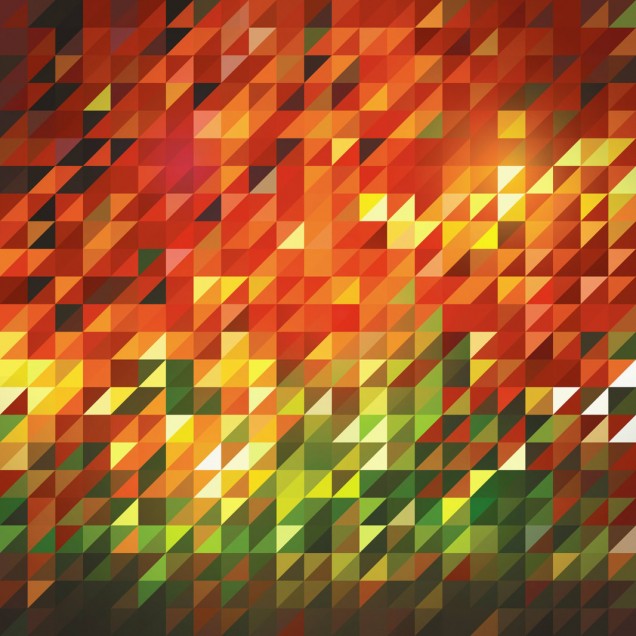 Tapet geometric abstract Slanted cu culori calde,  pe un perete din spatele unei canapele negre