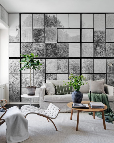 Tapet 3D Factory Window, Graphite, cu o vedere a unei păduri printr-un perete din sticlă, în tonuri de gri monocromatice.
