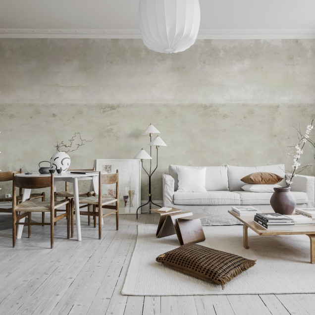 Tapet Urban Horizon Sand, cu aspect de beton texturat, aplicat pe un perete din dormitor