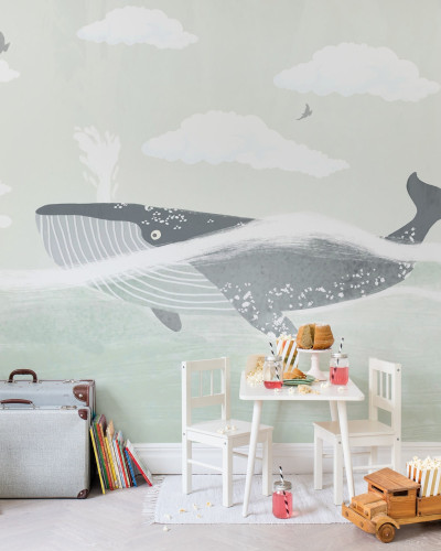 Tapet cu balenă Happy Whale - design cu o balenă albastră care înoată printre nori albi pe un fundal verde deschis.