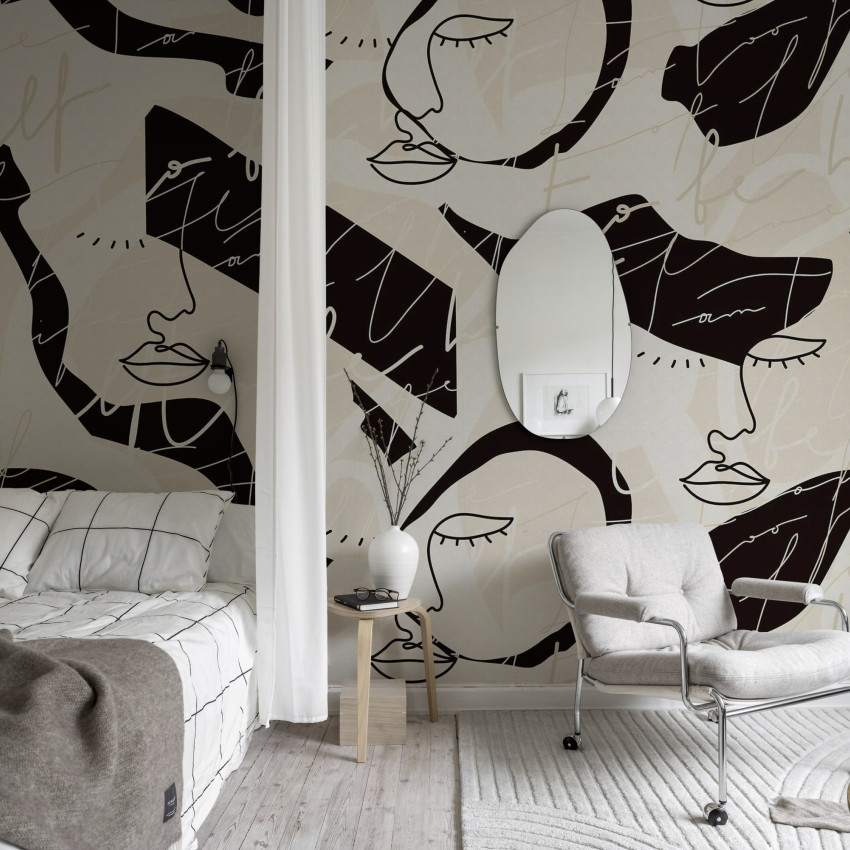 Tapet cu fețe stilizate, în design grafic monocrom, cu accente de gri.