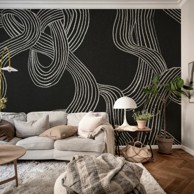 Tapet abstract cu linii albe pe fond negru într-un living modern
