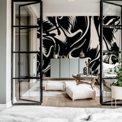 Tapet artistic cu forme negre si albe intr-un living modern.