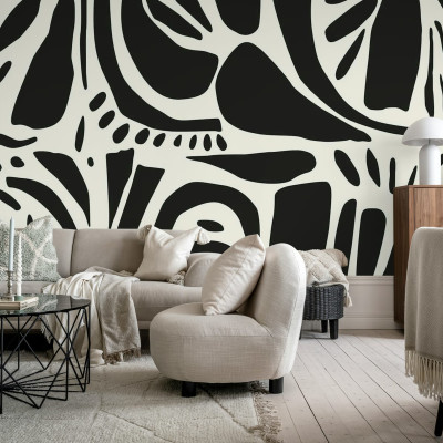 Tapet abstract cu design geometric, negru și alb, în living.