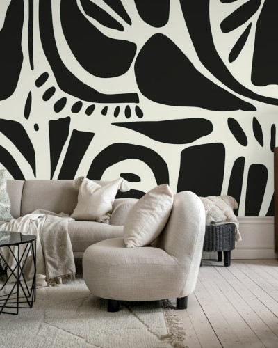 Tapet abstract cu design geometric, negru și alb, în living.