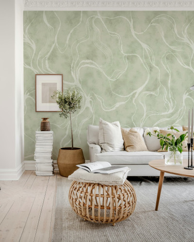 Tapet verde cu model de curbe albe într-un living elegant