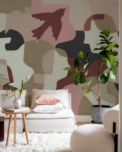 Fototapet abstract cu nuanțe de roz și roșu într-un interior modern