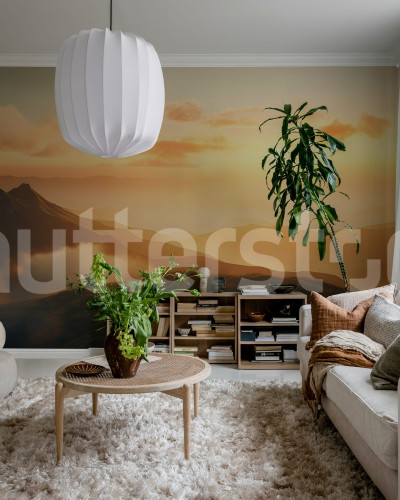 Fototapet cu peisaj montan la apus într-un living modern