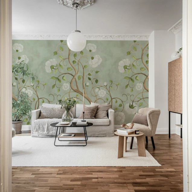 Fototapet cu un design floral subtil, cu tije și flori albe pe un fundal verde deschis, integrat într-un dormitor modern.