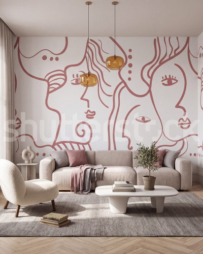 Tapet cu portrete abstracte în nuanțe de roz, aplicat pe un perete într-un living modern