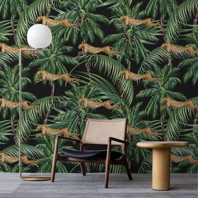 Jungle pattern wallpaper with cheetahs leaping through palm trees on a black background.