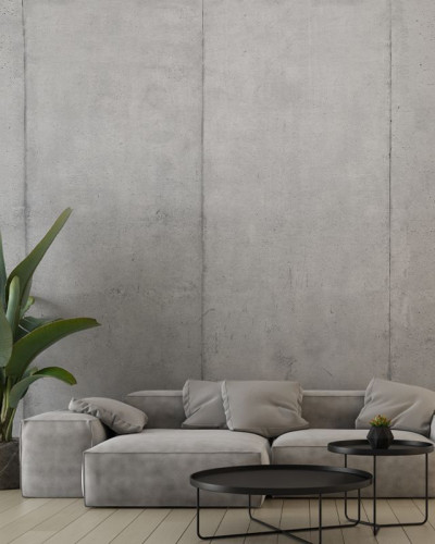 Tapet cu blocuri de beton, design modern și minimalist, cu o canapea gri în prim plan.