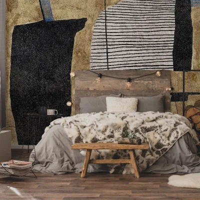 Tapet personalizat cu design abstract, cu forme geometrice și texturi delicate, în nuanțe de negru, gri și auriu, montat pe peretele unui dormitor modern.