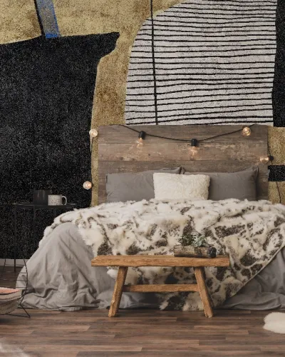 Tapet personalizat cu design abstract, cu forme geometrice și texturi delicate, în nuanțe de negru, gri și auriu, montat pe peretele unui dormitor modern.