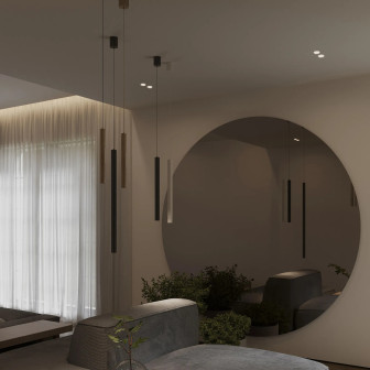 Pendul Ray negru, suspendat într-un living modern cu oglindă rotundă și plante, oferind iluminat discret