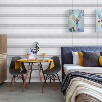 Panouri decorative autoadezive albe cu linii negre într-un interior modern