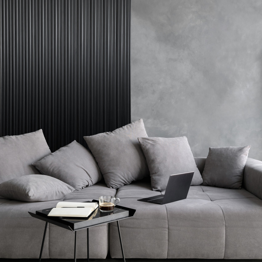 Panou decorativ riflat 3D negru într-un living modern